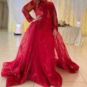 Gorgeous long sleeved red dress with tail